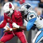 Carolina Panthers defensive end Brian Burns forces a fumble by Arizona Cardinals quarterback Kyler Murray during the second half of an NFL football game on Sunday, Oct. 2, 2022, in Charlotte, N.C. (AP Photo/Jacob Kupferman)