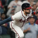 Atlanta Braves catcher Travis d'Arnaud (16) runs after hitting an RBI single during the sixth inning in Game 2 of baseball's National League Division Series between the Atlanta Braves and the Philadelphia Phillies, Wednesday, Oct. 12, 2022, in Atlanta. (AP Photo/Brynn Anderson)