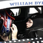 William Byron puts on his helmet during NASCAR cup series qualifying at Homestead-Miami Speedway, Saturday, Oct. 22, 2022, in Homestead, Fla. (AP Photo/Daryl Graham)