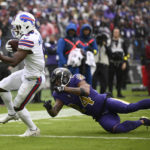 
              Buffalo Bills wide receiver Isaiah McKenzie (6) scores a touchdown past Baltimore Ravens cornerback Marcus Peters (24) on a 4-yard pass reception in the first half of an NFL football game Sunday, Oct. 2, 2022, in Baltimore. (AP Photo/Nick Wass)
            