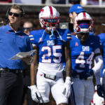 SMU head coach Rhett Lashlee looks on from the sidelines during the first half of an NCAA college football game against Cincinnati, Saturday, Oct. 22, 2022, in Dallas. (AP Photo/Brandon Wade)