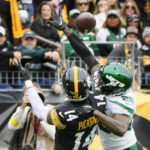 
              New York Jets safety Lamarcus Joyner (29) grabs Pittsburgh Steelers wide receiver George Pickens (14) as he breaks up a pass during the first half of an NFL football game, Sunday, Oct. 2, 2022, in Pittsburgh. No penalty was called. (AP Photo/Gene J. Puskar)
            