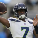 Seattle Seahawks quarterback Geno Smith (7) warms up before an NFL football game against the Los Angeles Chargers Sunday, Oct. 23, 2022, in Inglewood, Calif. (AP Photo/Mark J. Terrill)