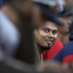 
              Minnesota Twins' Luis Arraez smiles on the bench during the eighth inning of a baseball game against the Chicago White Sox Wednesday, Oct. 5, 2022, in Chicago. (AP Photo/Nam Y. Huh)
            