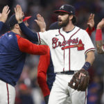 
              Atlanta Braves' Dansby Swanson celebrates with teammates after their 4-2 victory in a baseball game against the New York Mets, Saturday, Oct. 1, 2022, in Atlanta. (AP Photo/Brett Davis)
            