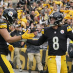 
              Pittsburgh Steelers quarterback Kenny Pickett (8) is congratulated by tight end Pat Freiermuth (88) after diving cross the goal to score against the New York Jets during the second half of an NFL football game, Sunday, Oct. 2, 2022, in Pittsburgh. (AP Photo/Gene J. Puskar)
            