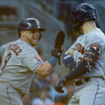 Houston Astros catcher Christian Vazquez (9) congratulates Chas McCormick (20) after McCormick hit a two-run home run against the New York Yankees during the second inning of Game 3 of an American League Championship baseball series, Saturday, Oct. 22, 2022, in New York. (AP Photo/John Minchillo)