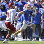 Florida wide receiver Ricky Pearsall (1) rushes for a 76-yard touchdown past Eastern Washington defensive back Kentrell Williams Jr. (34) during the first half of an NCAA college football game, Sunday, Oct. 2, 2022, in Gainesville, Fla. (AP Photo/Phelan M. Ebenhack)