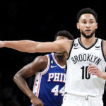 Brooklyn Nets guard Ben Simmons (10) points during the first half of a preseason NBA basketball game against the Philadelphia 76ers, Monday, Oct. 3, 2022, in New York. (AP Photo/Julia Nikhinson)