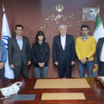 
              In this photo released by Iran's Ministry of Sport and Youth, Minister of Sport and Youth Hamid Sajjadi, center right, and climber Elnaz Rekabi, center left, pose for a photo, in Tehran, Iran, Wednesday, Oct. 19, 2022. Rekabi returned to Tehran early Wednesday after competing in South Korea without wearing a headscarf, an act widely seen as support for anti-government demonstrators amid weeks of protests over the Islamic Republic's mandatory hijab. (Ministry of Sport and Youth via AP)
            