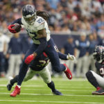 
              Tennessee Titans running back Derrick Henry (22) gets past Houston Texans defenders as he runs 29 yards for a touchdown during the first half of an NFL football game Sunday, Oct. 30, 2022, in Houston. (AP Photo/Eric Christian Smith)
            