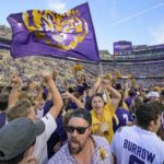 
              Fans celebrate after they came onto the field after LSU defeated Mississippi in an NCAA college football game in Baton Rouge, La., Saturday, Oct. 22, 2022. (AP Photo/Matthew Hinton)
            