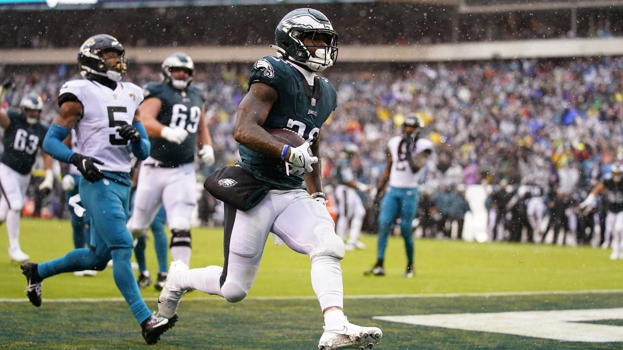 Philadelphia Eagles' Miles Sanders scores a touchdown during the first half of an NFL football game...