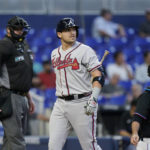 Atlanta Braves' Austin Riley reacts after striking out during the first inning of a baseball game against the Miami Marlins, Tuesday, Oct. 4, 2022, in Miami. (AP Photo/Wilfredo Lee)