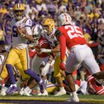 
              LSU quarterback Jayden Daniels (5) makes a touchdown untouched during the first half of an NCAA college football game against Mississippi in Baton Rouge, La., Saturday, Oct. 22, 2022. (AP Photo/Matthew Hinton)
            