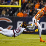 
              Washington Commanders cornerback Kendall Fuller dives to tackle Chicago Bears wide receiver Equanimeous St. Brown in the second half of an NFL football game in Chicago, Thursday, Oct. 13, 2022. (AP Photo/Nam Y. Huh)
            