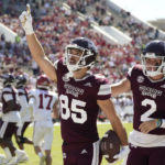 Mississippi State wide receiver Austin Williams (85) celebrates his 10-yard pass reception from quarterback Will Rogers (2) during the first half of an NCAA college football game against Arkansas in Starkville, Miss., Saturday, Oct. 8, 2022. (AP Photo/Rogelio V. Solis)