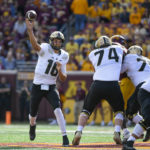 
              Purdue quarterback Aidan O'Connell (16) throws downfield against Minnesota during the first half an NCAA college football game on Saturday, Oct. 1, 2022, in Minneapolis. Purdue won 20-10. (AP Photo/Craig Lassig)
            