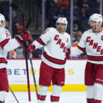 
              Carolina Hurricanes' Jesper Fast (71), Jordan Martinook (48) and Jordan Staal (11) celebrate after a goal by Martinook during the first period of an NHL hockey game against the Philadelphia Flyers, Saturday, Oct. 29, 2022, in Philadelphia. (AP Photo/Matt Slocum)
            