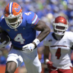 Florida wide receiver Justin Shorter (4) runs to the end zone for a 75-yard touchdown on a reception in front of Eastern Washington defensive back Anthany Smith (4), right, during the first half of an NCAA college football game, Sunday, Oct. 2, 2022, in Gainesville, Fla. (AP Photo/Phelan M. Ebenhack)