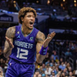 
              Charlotte Hornets guard Kelly Oubre Jr. (12) reacts to a no call during the first half of an NBA basketball game against the Golden State Warriors, Saturday, Oct. 29, 2022, in Charlotte, N.C. (AP Photo/Scott Kinser)
            