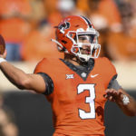 
              Oklahoma State quarterback Spencer Sanders (3) looks to throw a pass during the first half of an NCAA college football game against Texas, Saturday, Oct. 22, 2022, in Stillwater, Okla. (AP Photo/Brody Schmidt)
            