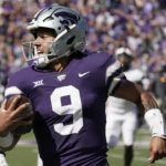 
              FILE - Kansas State quarterback Adrian Martinez runs the ball during the first half of an NCAA college football game against Texas Tech Saturday, Oct. 1, 2022, in Manhattan, Kan. Kansas State quarterback Adrian Martinez and Iowa linebacker Jack Campbell were among 15 players named finalists Wednesday, Oct. 26, 2022, for the William V. Campbell Trophy, given to college football's top scholar-athlete.(AP Photo/Charlie Riedel, File)
            