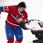 Montreal Canadiens' Arber Xhekaj (72) and Arizona Coyotes' Zack Kassian, right, fight during first-period NHL hockey game action in Montreal, Thursday, Oct. 20, 2022. (Paul Chiasson/The Canadian Press via AP)