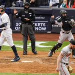 New York Yankees' Aaron Judge, left, reacts after striking out during the seventh inning of a baseball game against the Baltimore Orioles, Sunday, Oct. 2, 2022, in New York. (AP Photo/Frank Franklin II)