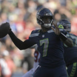 Seattle Seahawks quarterback Geno Smith (7) passes against the Arizona Cardinals during the second half of an NFL football game in Seattle, Sunday, Oct. 16, 2022. (AP Photo/Caean Couto)