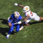 
              Iowa State linebacker O'Rien Vance (34) pressures Kansas quarterback Jalon Daniels (6) during the first half of an NCAA college football game, Saturday, Oct. 1, 2022, in Lawrence, Kan. (AP Photo/Reed Hoffmann)
            