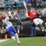 Florida wide receiver Justin Shorter (4) makes a reception in front of Georgia defensive back Kelee Ringo (5) during the first half of an NCAA college football game Saturday, Oct. 29, 2022, in Jacksonville, Fla. (AP Photo/John Raoux)