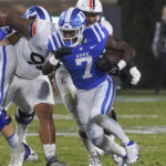 Duke's Jordan Waters (7) carries the ball during the first half of the team's NCAA college football game against Virginia in Durham, N.C., Saturday, Oct. 1, 2022. (AP Photo/Ben McKeown)
