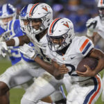
              Virginia's Perris Jones (2) carries the ball during the first half of the team's NCAA college football game against Duke in Durham, N.C., Saturday, Oct. 1, 2022. (AP Photo/Ben McKeown)
            
