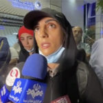 
              In this image taken from video by Iran's state-run IRNA news agency, Iranian competitive climber Elnaz Rekabi speaks to journalists in Imam Khomeini International Airport in Tehran, Iran, Wednesday, Oct. 19, 2022. Rekabi received a hero's welcome on her return to Tehran early Wednesday, after competing in South Korea without wearing a mandatory headscarf required of female athletes from the Islamic Republic. Rekabi has described her not wearing a hijab as "unintentional" after Farsi-language media abroad raised concerns about her safety. (IRNA via AP)
            