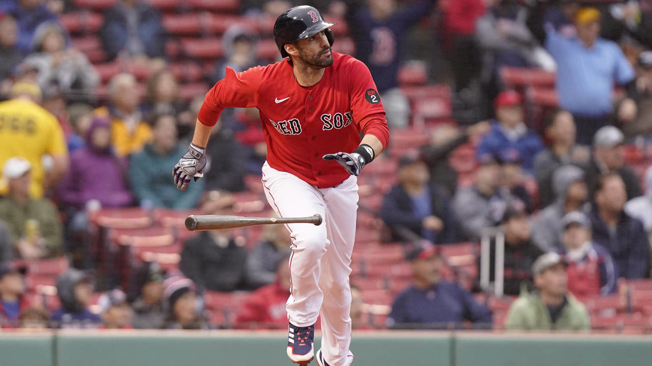 Boston Red Sox's J.D. Martinez runs toward first base after hitting a three-run home run in the fir...