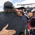 Dustin Johnson celebrates after his 4 Aces GC team won the LIV Golf Team Championship at Trump National Doral Golf Club, Sunday, Oct. 30, 2022, in Doral, Fla. (AP Photo/Lynne Sladky)