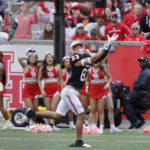
              Houston wide receiver Peyton Sawyer (83) makes a pass reception to score past South Florida safety Christian Williams (4) during the first half of an NCAA college football game Saturday, Oct. 29, 2022, in Houston. (AP Photo/Michael Wyke)
            