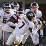 Texas A&M wide receiver Moose Muhammad III (7) pulls down a pass reception behind the Mississippi State defense during the second half of an NCAA college football game in Starkville, Miss., Saturday, Oct. 1, 2022. (AP Photo/Rogelio V. Solis)