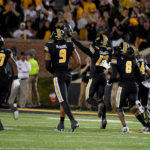 
              Missouri defensive back Daylan Carnell (13) celebrates with teammates after recovering a fumble during the first half of an NCAA college football game against Georgia Saturday, Oct. 1, 2022, in Columbia, Mo. (AP Photo/L.G. Patterson)
            