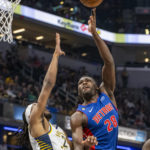 
              Detroit Pistons center Isaiah Stewart (28) shoots over Indiana Pacers forward Isaiah Jackson (22) during the first half of an NBA basketball game in Indianapolis, Saturday, Oct. 22, 2022. (AP Photo/Doug McSchooler)
            