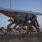
              Camels race during an exercise for an upcoming camel race, in Al Shahaniah, Qatar, Tuesday, Oct. 18, 2022. Camel racing is a staple in Qatar's culture and heritage. (AP Photo/Nariman El-Mofty)
            