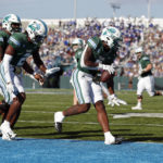 Tulane running back Shaadie Clayton (0) celebrates with wide receiver Duece Watts (2) after scoring a touchdown during the first half of an NCAA college football game against Memphis in New Orleans, Saturday, Oct. 22, 2022. (AP Photo/Tyler Kaufman)