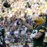 Green Bay Packers quarterback Aaron Rodgers throws a pass during the second half of an NFL football game against the New England Patriots, Sunday, Oct. 2, 2022, in Green Bay, Wis. (AP Photo/Morry Gash)