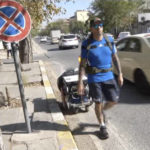 
              In this frame grab from video, 41-year-old Santiago Sánchez, a Spanish man who was documenting his travel by foot from Madrid to Doha for the 2022 FIFA World Cup carries a suitcase in a wheeled cart, in Sulaymaniyah, Iraq, Sept. 28, 2022. Sánchez has not been heard from since crossing into Iran three weeks ago, stirring fears about his fate in a country convulsed by mass unrest. That's according to his family, who spoke to The Associated Press on Monday, Oct. 24, 2022. He was an experienced trekker, former paratrooper and fervent soccer fan. (AP Photo)
            