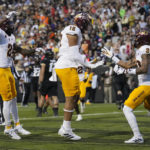 Arizona State tight end Jalin Conyers, center, celebrates after making a touchdown catch with wide receivers Elijhah Badger, left, and Giovanni Sanders in the first half of an NCAA college football game against Colorado, Saturday, Oct. 29, 2022, in Boulder, Colo. (AP Photo/David Zalubowski)