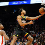 Phoenix Suns' Cameron Payne (15) goes to the basket as Houston Rockets' Josh Christopher (9) looks on during the second half of an NBA basketball game, Sunday, Oct. 30, 2022, in Phoenix. (AP Photo/Darryl Webb)