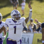 
              James Madison quarterback Todd Centeio (1) waves to fans in the stands after scoring a touchdown during the first half of an NCAA football game against Georgia Southern, Saturday, Oct. 15, 2022, in Statesboro, Ga. (AP Photo/Stephen B. Morton)
            