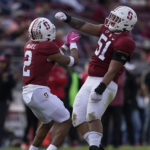 
              Stanford safety Jonathan McGill (2) celebrates with defensive lineman Jaxson Moi (51) during the second half of an NCAA college football game against Arizona State in Stanford, Calif., Saturday, Oct. 22, 2022. (AP Photo/Jeff Chiu)
            