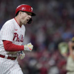 Philadelphia Phillies' Rhys Hoskins celebrates after a two-run home run during the fifth inning in Game 4 of the baseball NL Championship Series between the San Diego Padres and the Philadelphia Phillies on Saturday, Oct. 22, 2022, in Philadelphia. (AP Photo/Matt Rourke)